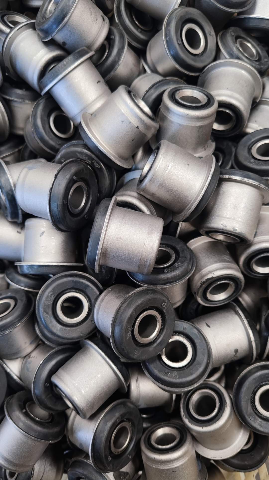 Control arm rubber bushings with metal outer sleeves and inner sleeves